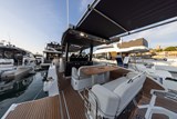 Portside drop down balcony lowered. Retractable sun shade above seating area.